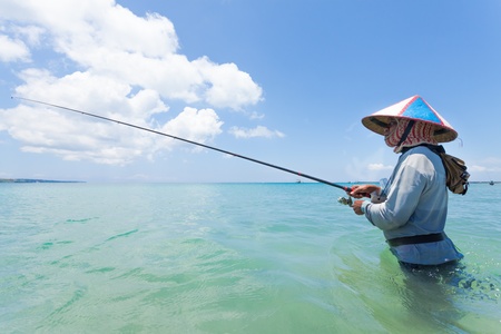 BALI - FEBRUARY 13. Line fishermen on Jimberan beach on February 13, 2012 in Bali, Indonesia. Local fishermen find it harder to make a living due to a lack of fish caused by industrial fishing.のeditorial素材