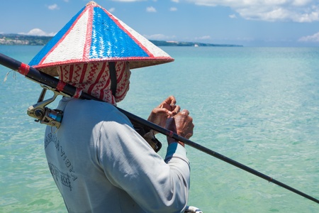 BALI - FEBRUARY 13. Line fishermen on Jimberan beach on February 13, 2012 in Bali, Indonesia. Local fishermen find it harder to make a living due to a lack of fish caused by industrial fishing.のeditorial素材