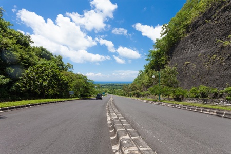 Large road leading to coast in Bali, Indonesiaの写真素材