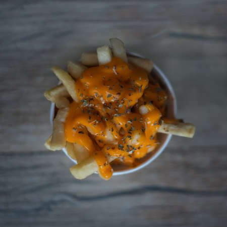 French fries with cheese topping and herbs topping top frame shotの写真素材
