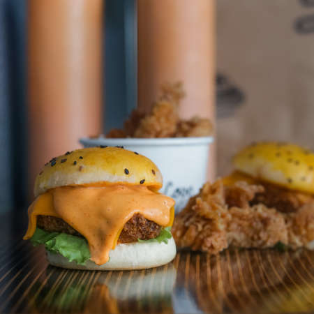Chicken Zinger Burger with sesame beans topping and filled with vegetablesの写真素材
