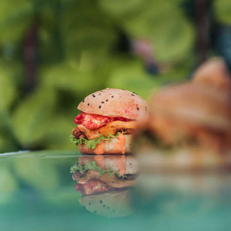 Chicken Zinger Burger with sesame beans topping and filled with vegetablesの写真素材