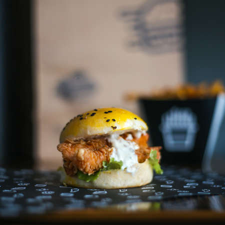 Chicken Zinger Burger with sesame beans topping and filled with vegetablesの写真素材