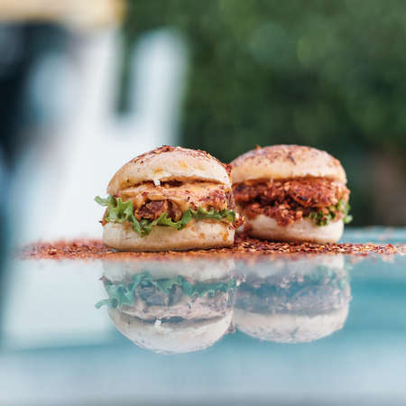 Chicken Zinger Burger with sesame beans topping and filled with vegetablesの写真素材