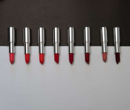 Lipstick. Fashion Colorful Lipsticks over black background. Lipstick tints palette, Professional Makeup and Beauty. Beautiful Make-up conceptの写真素材