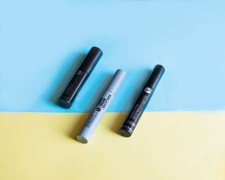 Eyeshadow with makeup base on a delicate blue and yellow background, makeup productsの写真素材