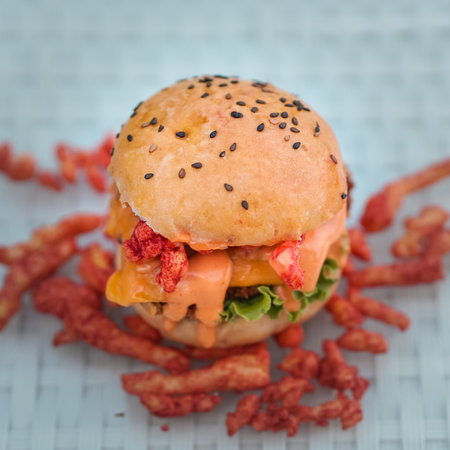 Chicken Zinger Burger with sesame beans topping and filled with vegetablesの写真素材