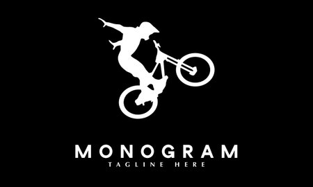 Mountain bike logo design. BMX rider vector illustration on black background.のイラスト素材