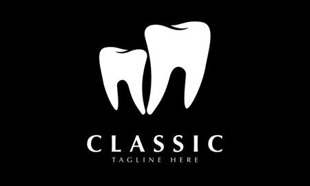 Tooth logo design vector template. White tooth with black background.のイラスト素材