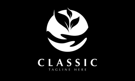 Black and white logo design with a hand holding a leaf in the circle.のイラスト素材