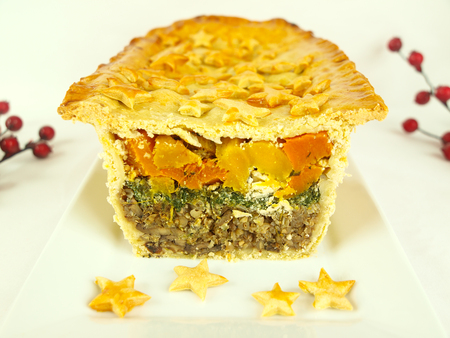 Layered Christmas Pie with pumpkin, spinach and buckwheatの写真素材