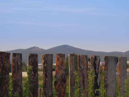Wooden fence and mountainsの写真素材