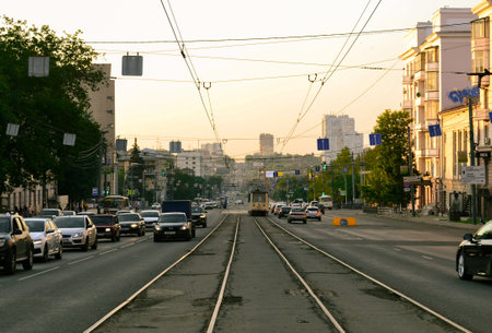 Chelyabinsk Russia - July 9, 2021. Sverdlovsky prospect. Car traffic on a street bathed in evening sunlightのeditorial素材