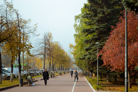 Chelyabinsk Russia - October 1, 2020. People walk along the footpath on the first day of Octoberのeditorial素材