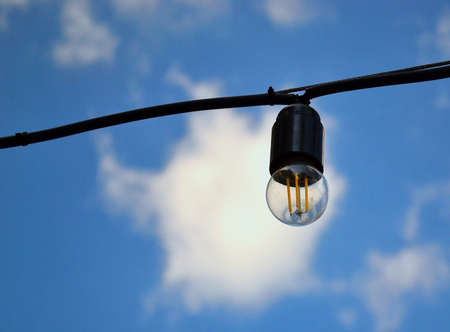 Street light. Blue sky. White clouds. Macro. Foreground