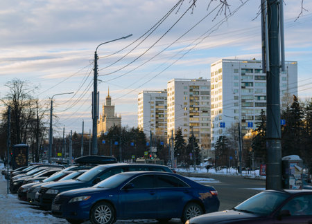 Chelyabinsk Russia - January 18, 2021. Lenin Avenue. A lot of cars in a row in the parking lot and a row of residential high-rise on the central buildings street of the city on a sunny winter eveningのeditorial素材