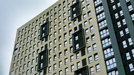 View of the facade of a modern building with many glass windows