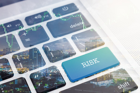 RISK : Green button keyboard computer.の写真素材