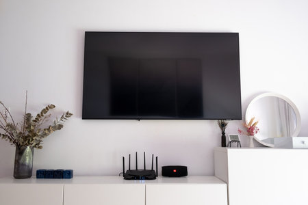 Interior room with TV, mirror and bedside tables in the Scandinavian style. High quality photo