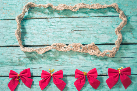 Frame made of twine in the old blue wooden boardsの写真素材