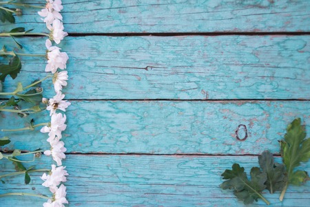 Fresh flowers of chrysanthemums on old wooden tableの写真素材