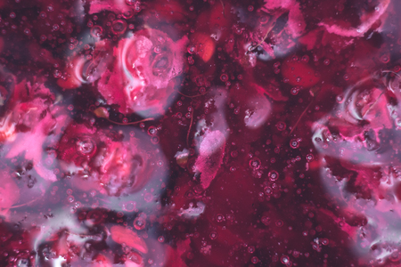 Macro of raspberry jam on a plateの写真素材