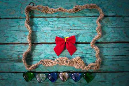 Frame made of twine in the old blue wooden boardsの写真素材