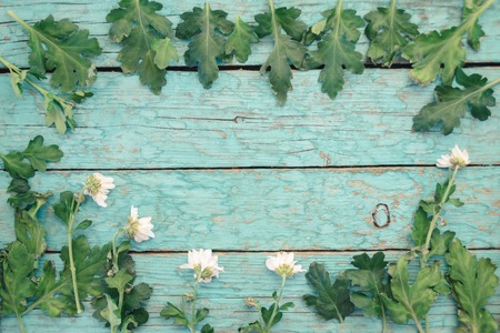 Fresh flowers of chrysanthemums on old wooden tableの写真素材