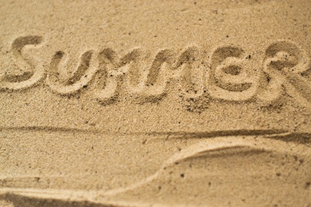 Macro Summer inscription on the sand at the beachの写真素材