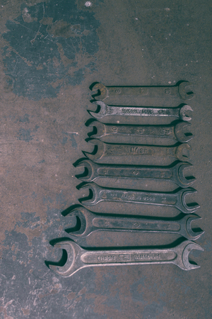 Old tools in a dark studio background on iron.の写真素材