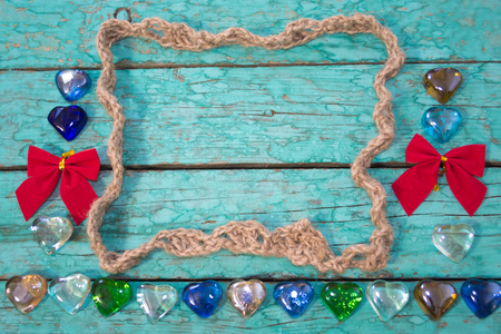 Frame made of twine in the old blue wooden boardsの写真素材