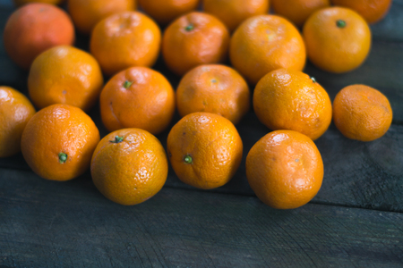 Fresh tangerine on a wooden background oldの写真素材