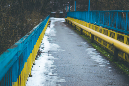 The bridge over the river with colored handrailsの写真素材