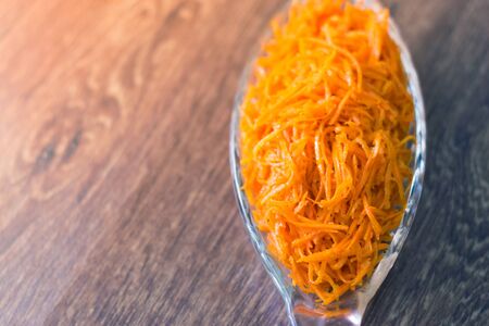 Grated carrot fresh salad on a plate.の写真素材