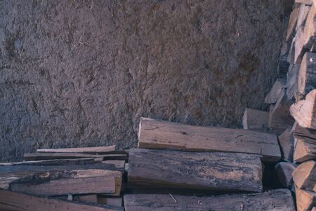 Firewood on the background wall with clayの写真素材