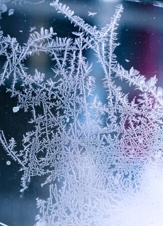Frosty patterns on the old window backgroundの写真素材
