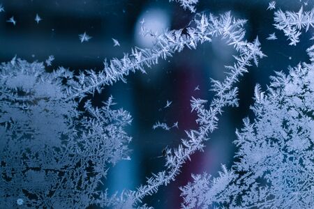 Frosty patterns on the old window backgroundの写真素材