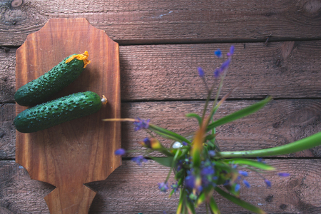 Fresh cucumber on a wooden backgroundの写真素材