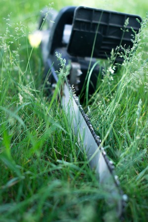 Electric saw on the lawn grassの写真素材