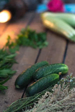 Fresh cucumber from the garden on a wooden backgroundの写真素材