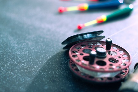 Fishing tackle on black background with blurred backgroundの写真素材