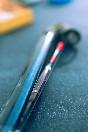 Fishing tackle on black background with blurred background