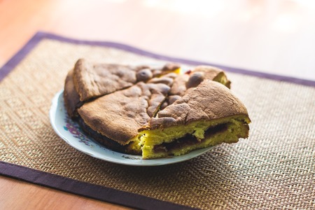 Homemade cake on a plate with a blurred background