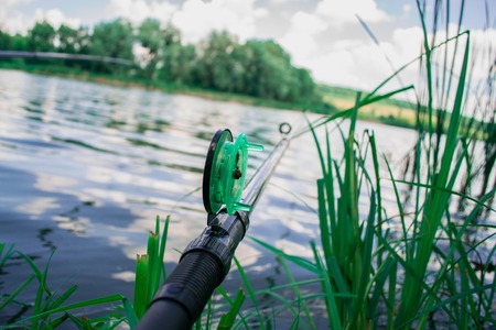 Fishing in the morning on the pond. Vacation, outdoor recreationの写真素材