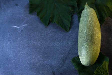 Fresh zucchini on a black matte backgroundの写真素材