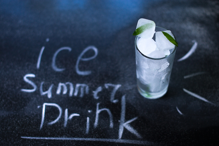 Natural ice in a glass on a black matte backgroundの写真素材