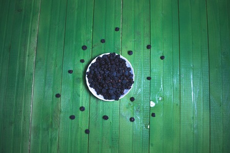 Fresh blackberries on a wooden green backgroundの写真素材