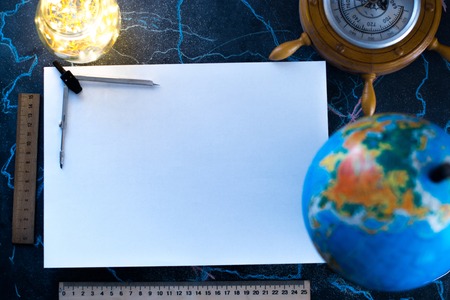 White sheet of mocap paper, against the background of the globe and lightsの写真素材