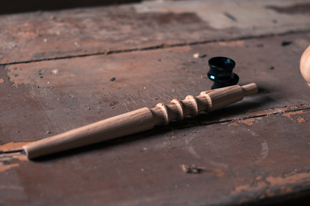 Wooden fragment ornament for shisha decoration on a wooden backgroundの写真素材