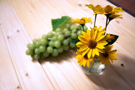 Grapes of grapes on a wooden tableの写真素材